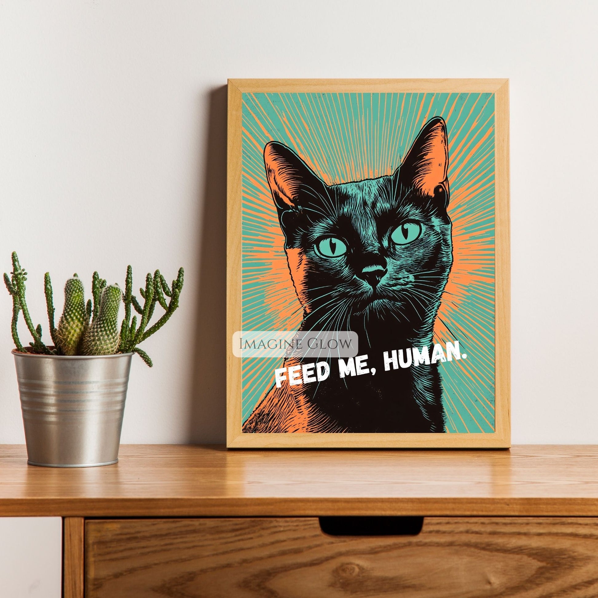 Bold and colorful black cat pop art with "Feed Me, Human" text.