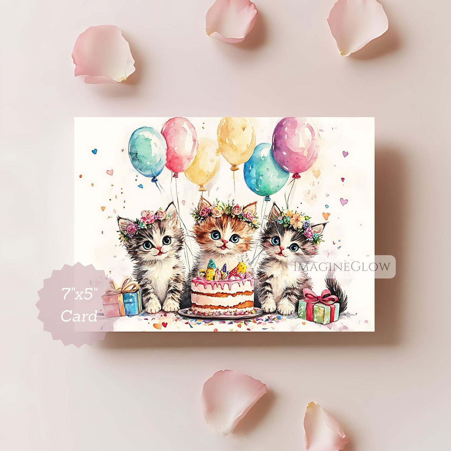Card with three kittens celebrating a birthday, surrounded by balloons and a cake, on a light pink background.