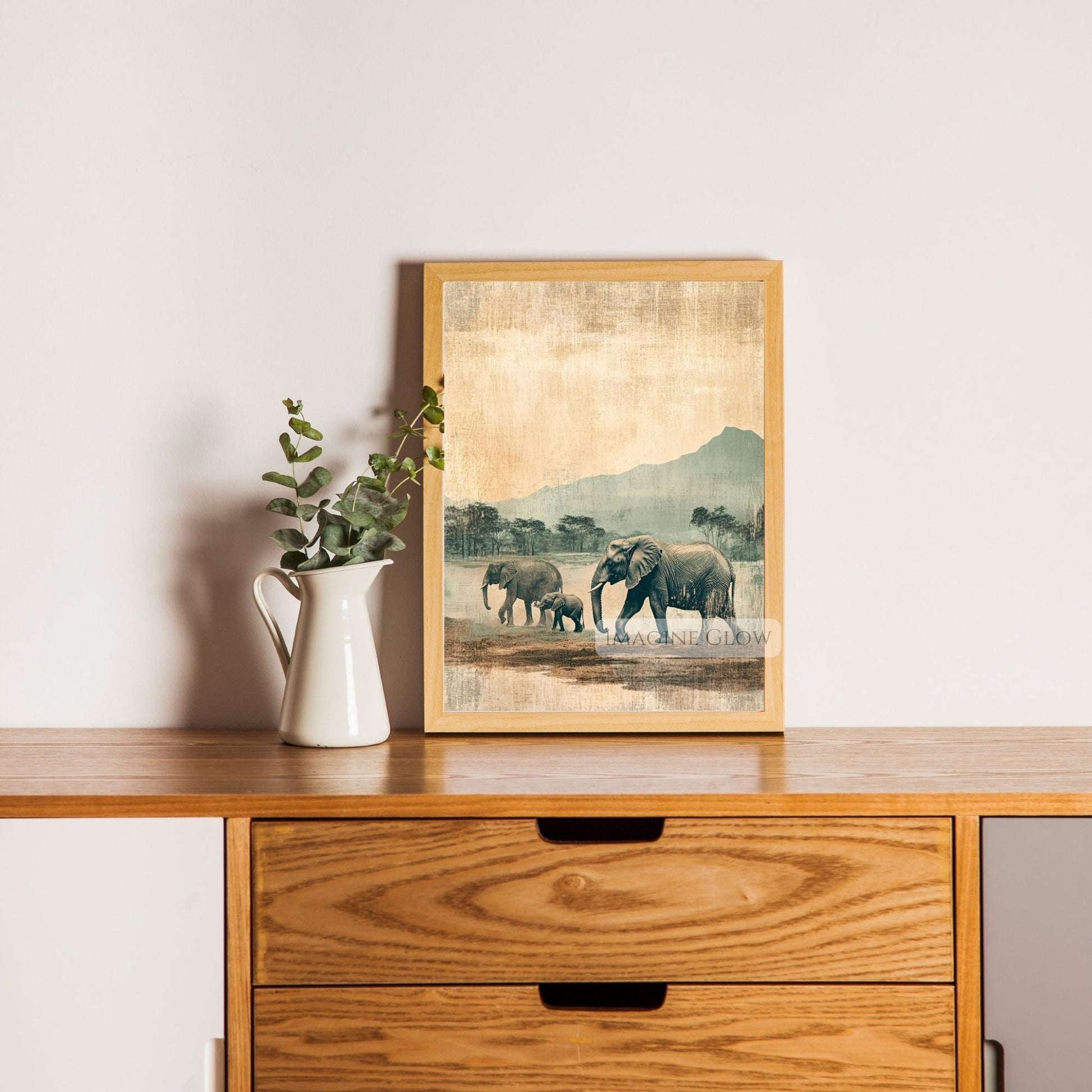 Elephant family artwork set in an antique savanna scene.