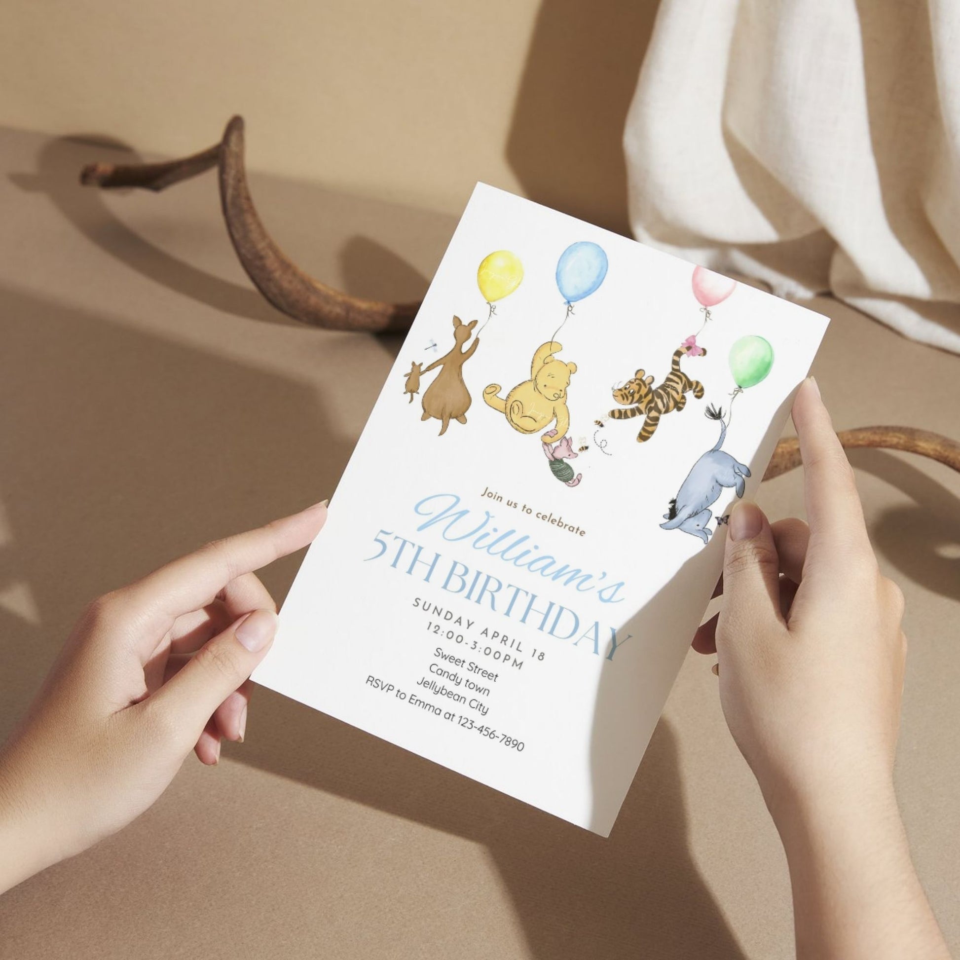 Adorable Winnie the Pooh birthday invitation template with a balloon.