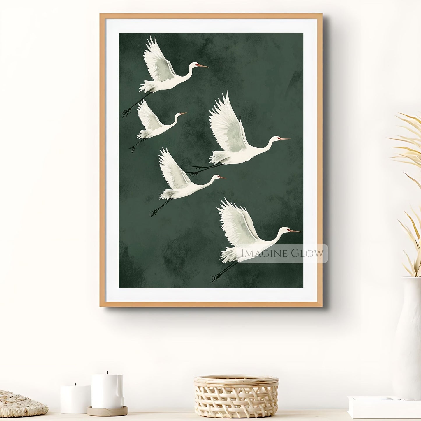 Green wall art featuring elegant Japanese cranes.