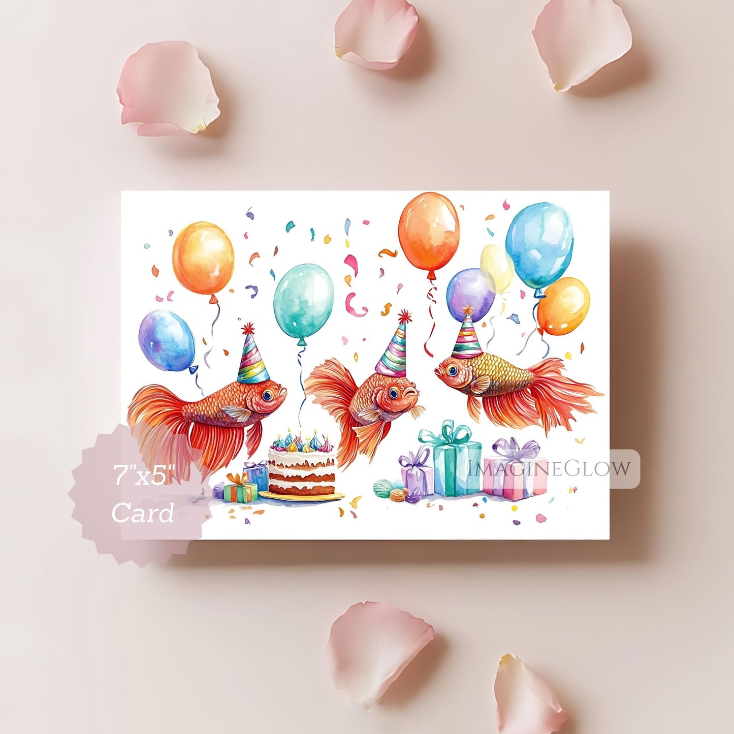 Birthday card with goldfish wearing party hats, balloons, and a cake on a light pink background.