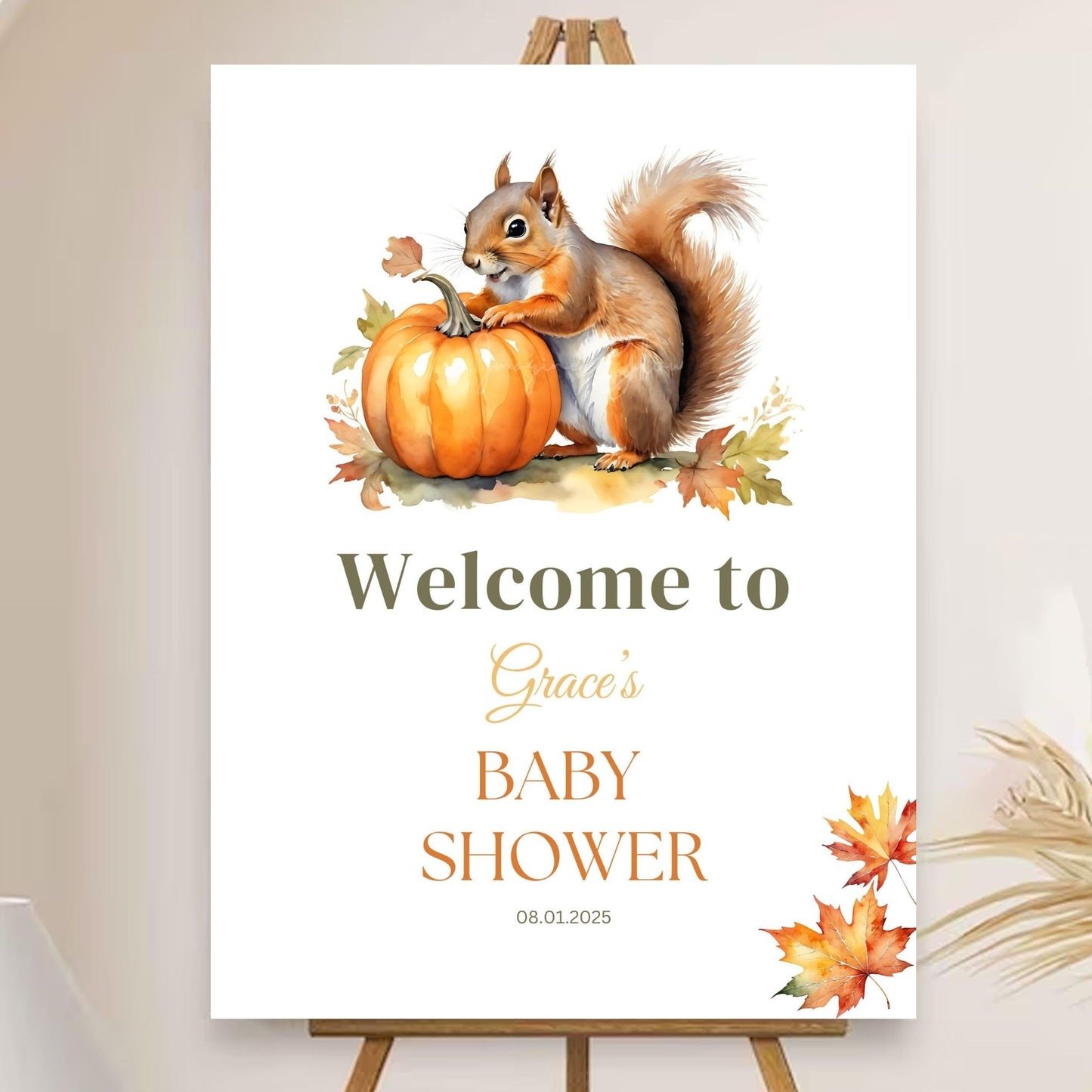 Fall theme Little Pumpkin baby shower decor with squirrel and pumpkin.
