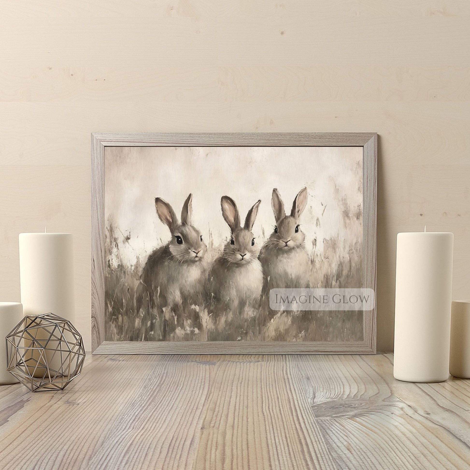Rustic farmhouse artwork featuring three rabbits in the grass