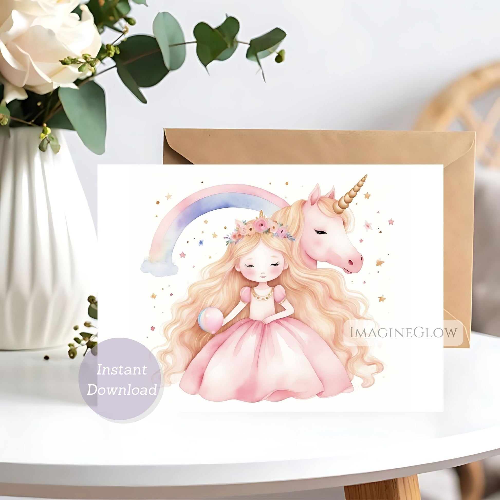 Greeting card with a unicorn and fairy design on a white surface with flowers in the background.