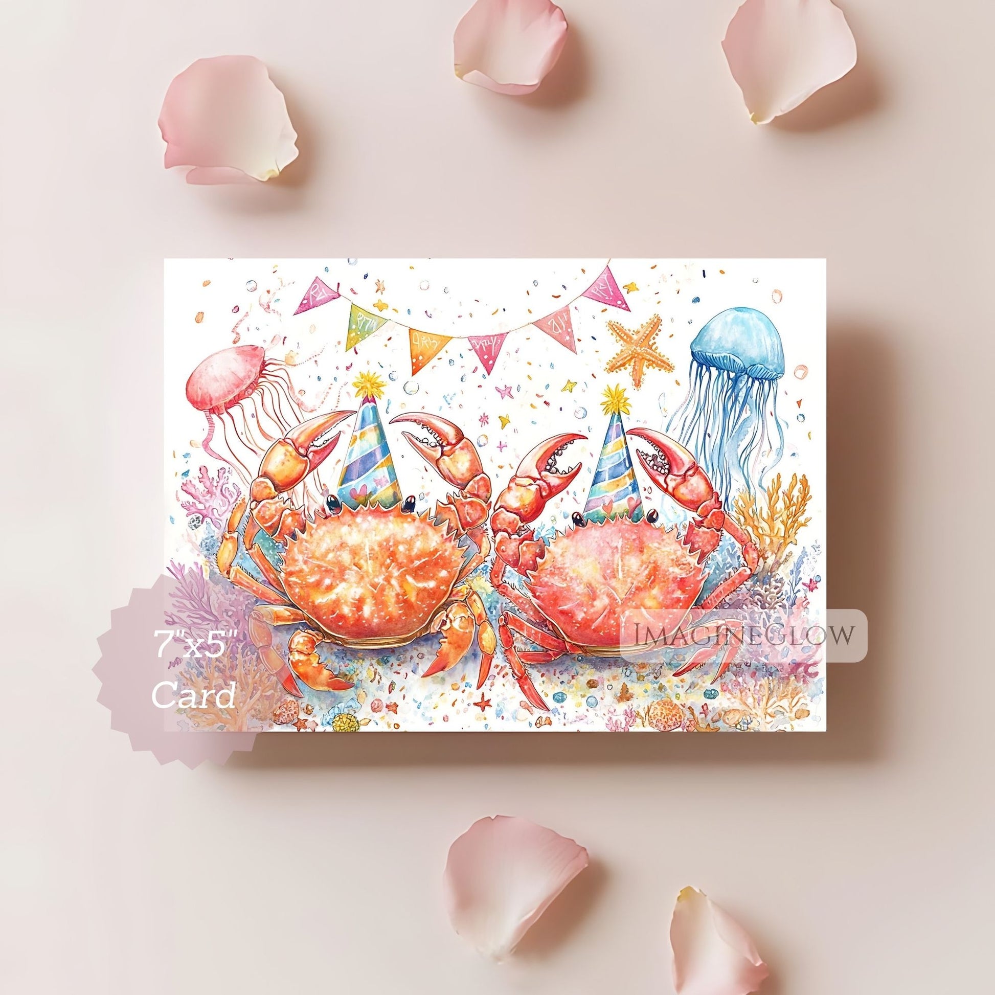 Illustrated card with crabs and jellyfish wearing party hats on a light pink background with flower petals.
