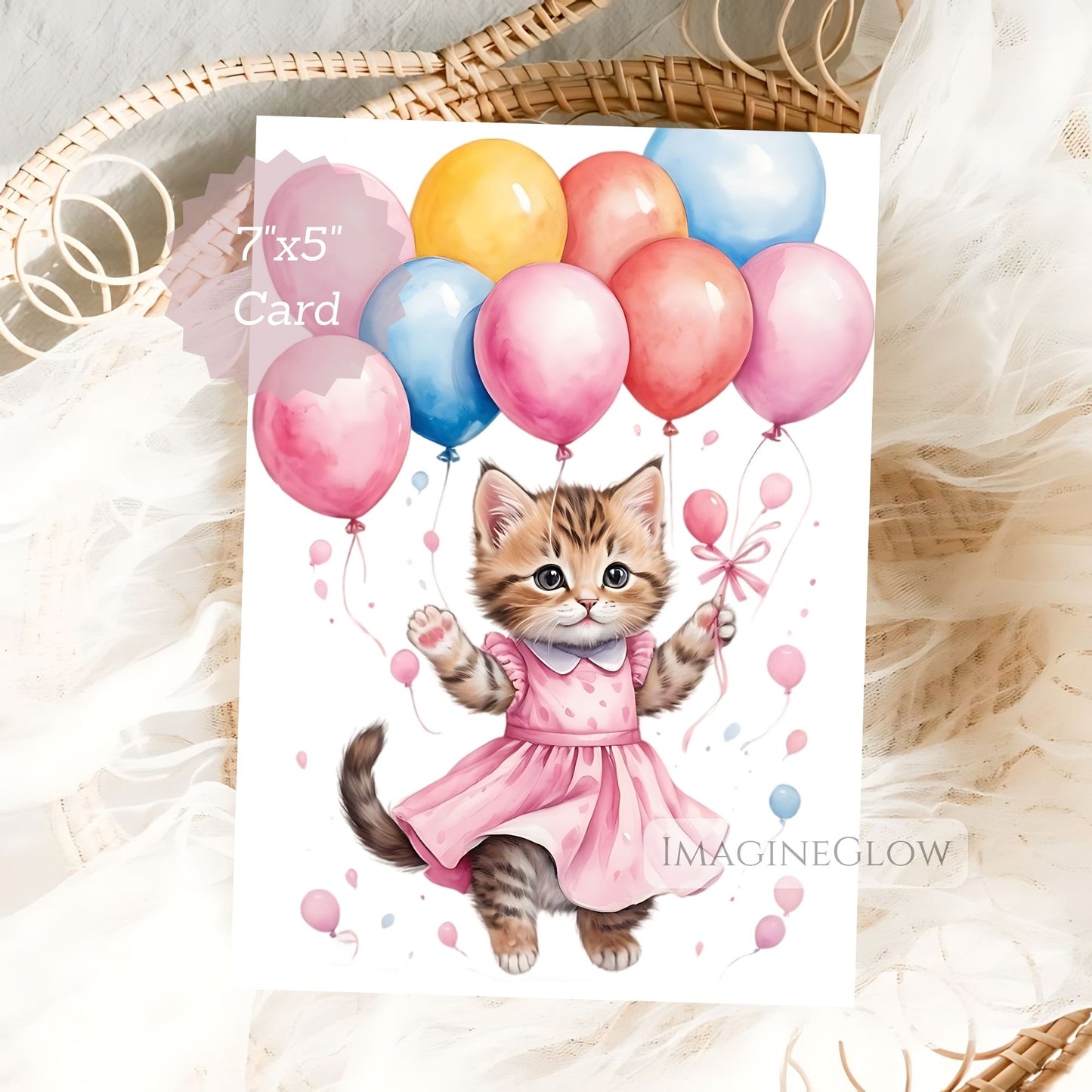 Card with a kitten in a pink dress holding balloons on a white background