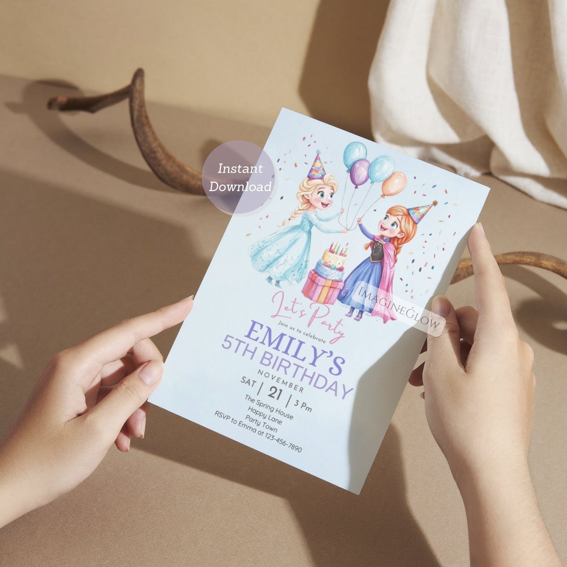 Person holding a birthday party invitation with cartoon characters on a beige surface