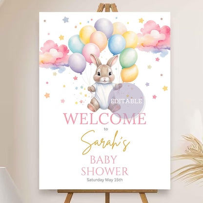 Baby shower welcome sign with balloon and bunny theme for party decor.