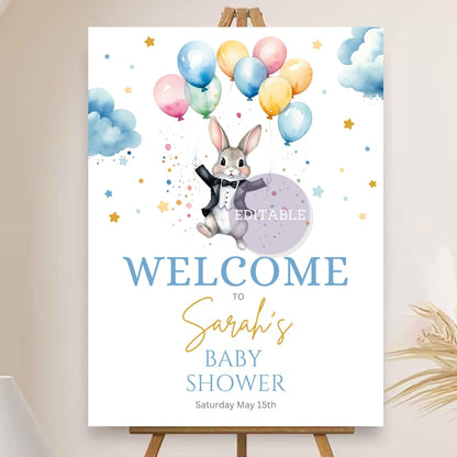 Baby shower welcome sign with balloon and bunny theme for party decor.