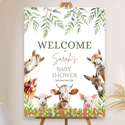 Personalized farm-themed party sign with greenery accents.
