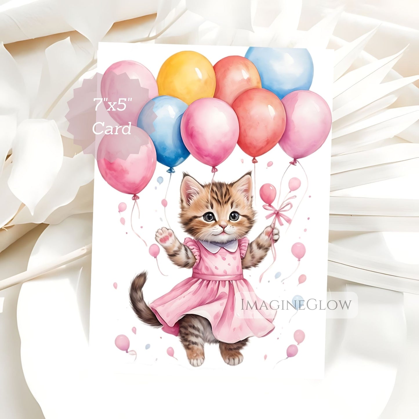 Card with a kitten in a pink dress holding balloons on a white background
