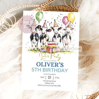 Birthday invitation card with cows, balloons, and a cake on a textured surface.