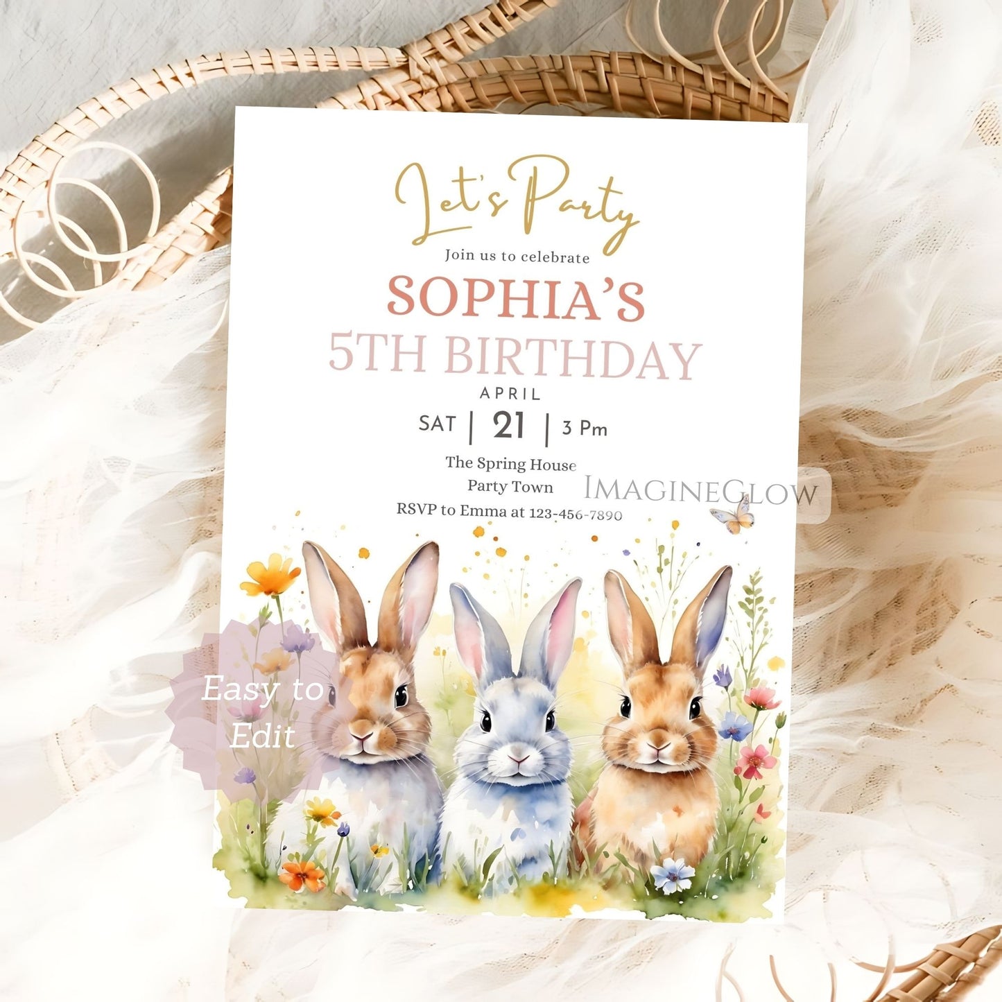 Birthday party invitation with rabbits and flowers on a textured surface