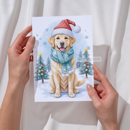 Hand holding a Christmas-themed card with a dog wearing a hat and scarf