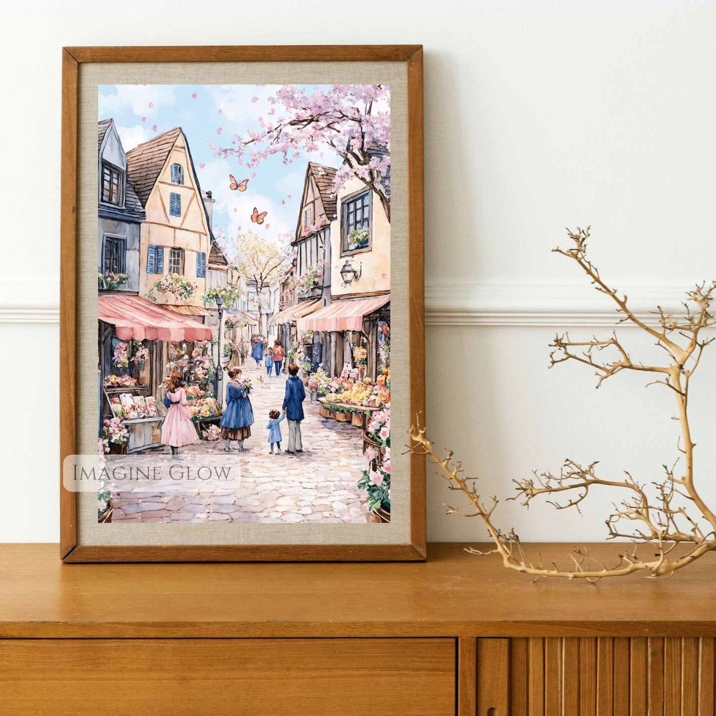 Peaceful spring cityscape featuring a cobblestone street and colorful flower market.
