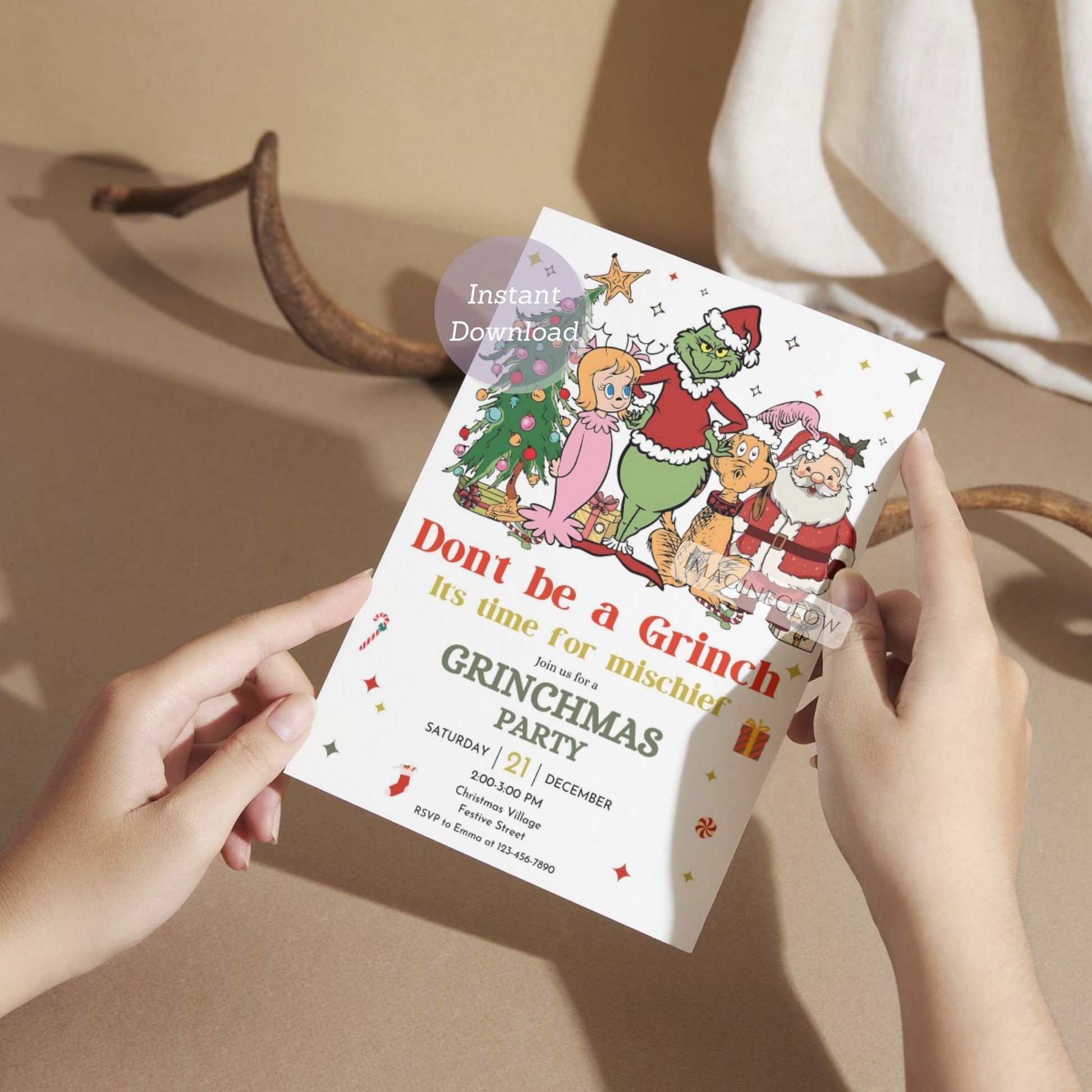 Invitation card for a Grinchmas party held by hands with a neutral background