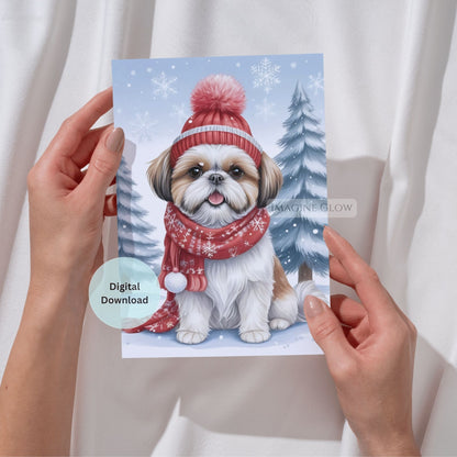 Card with a dog wearing a winter hat and scarf held by hands against a white background