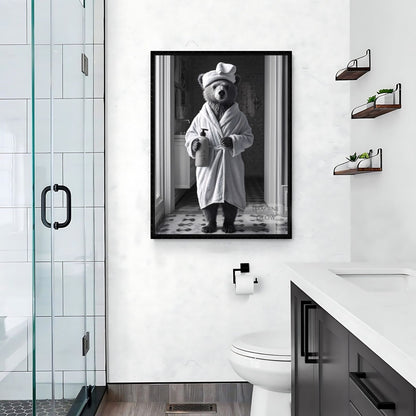 Restroom wall decor featuring a bear in black and white
