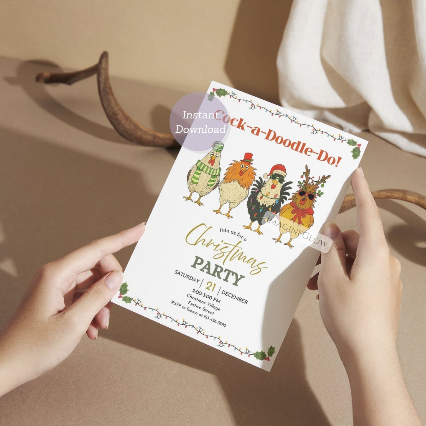 Person holding a Christmas party invitation with cartoon chickens on a beige surface