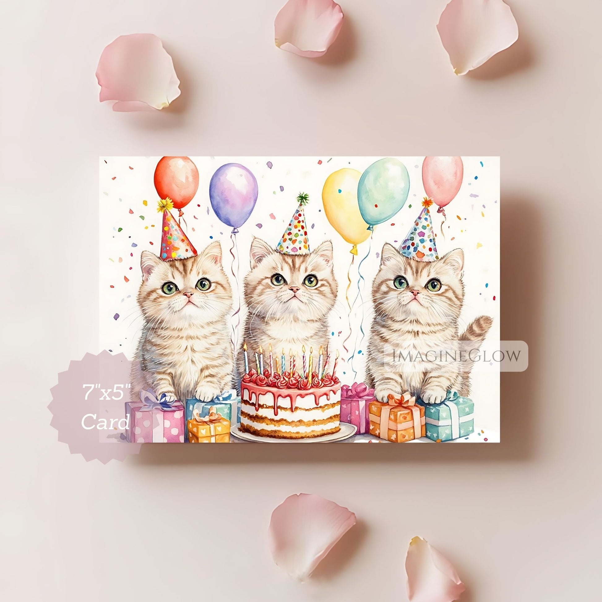 Birthday card with three cats, balloons, and a cake on a light pink background.