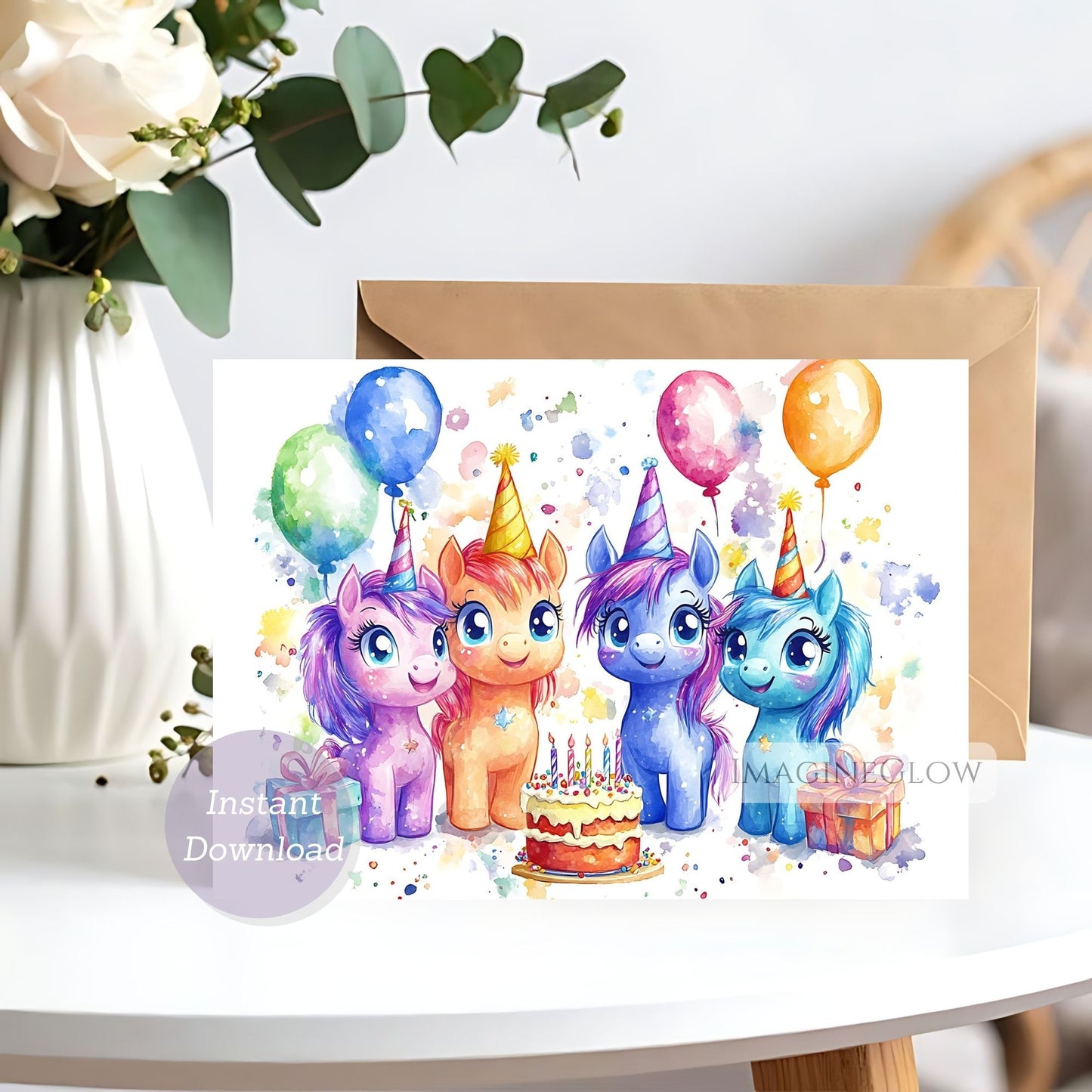 Birthday card with colorful unicorns and balloons on a white surface.