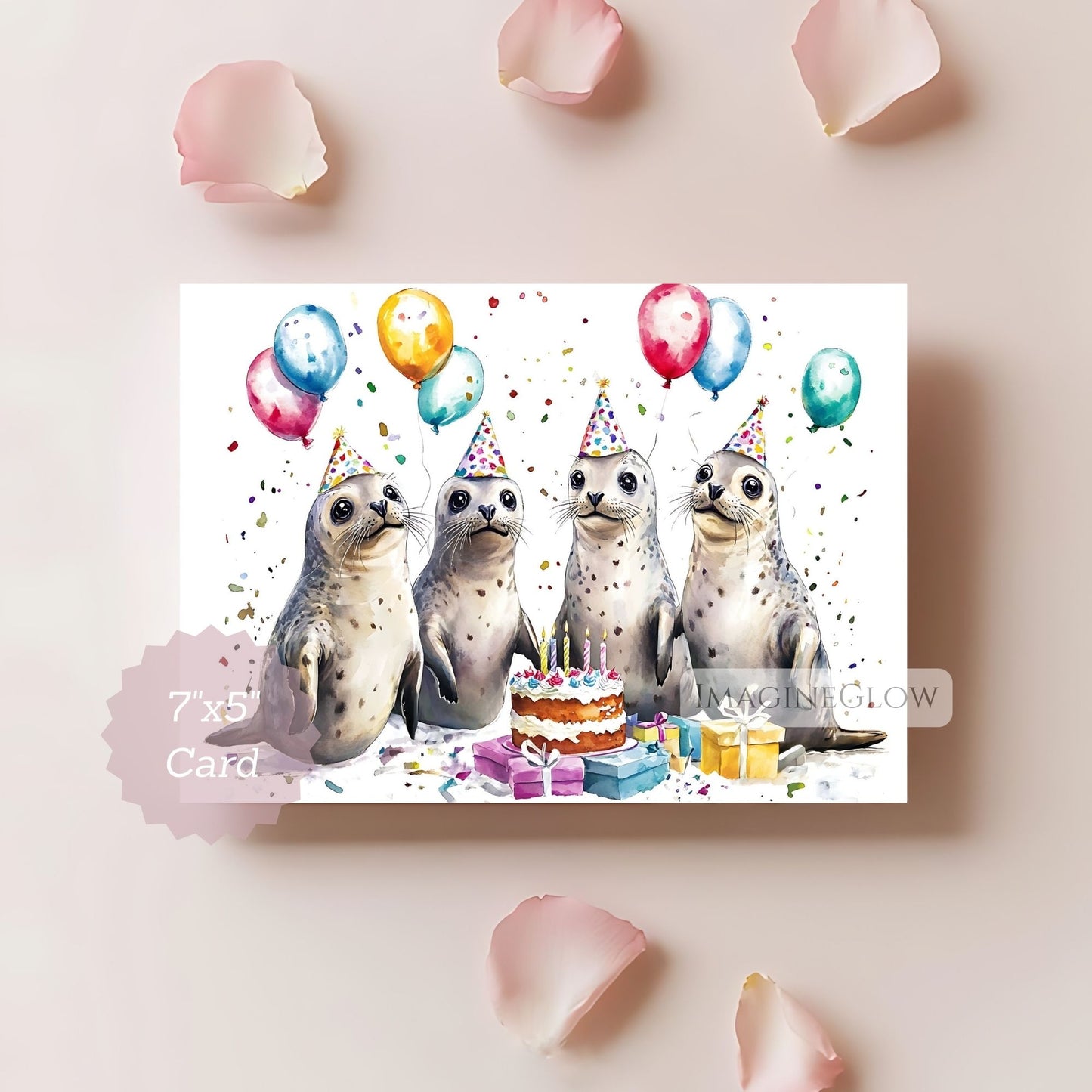 Birthday card with seals, balloons, and a cake on a light pink background