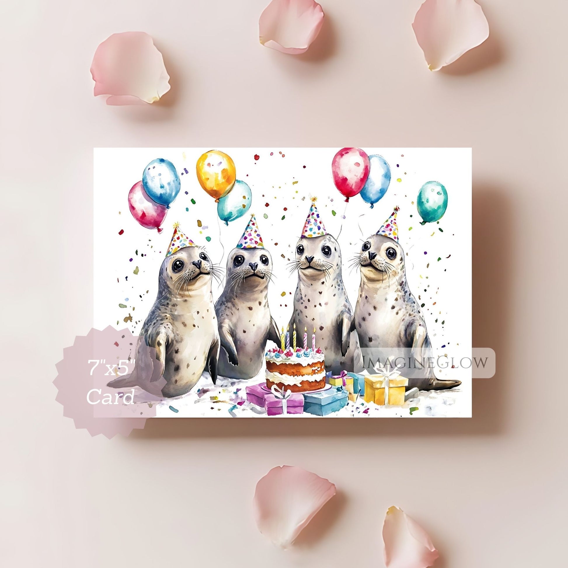 Birthday card with seals, balloons, and a cake on a light pink background
