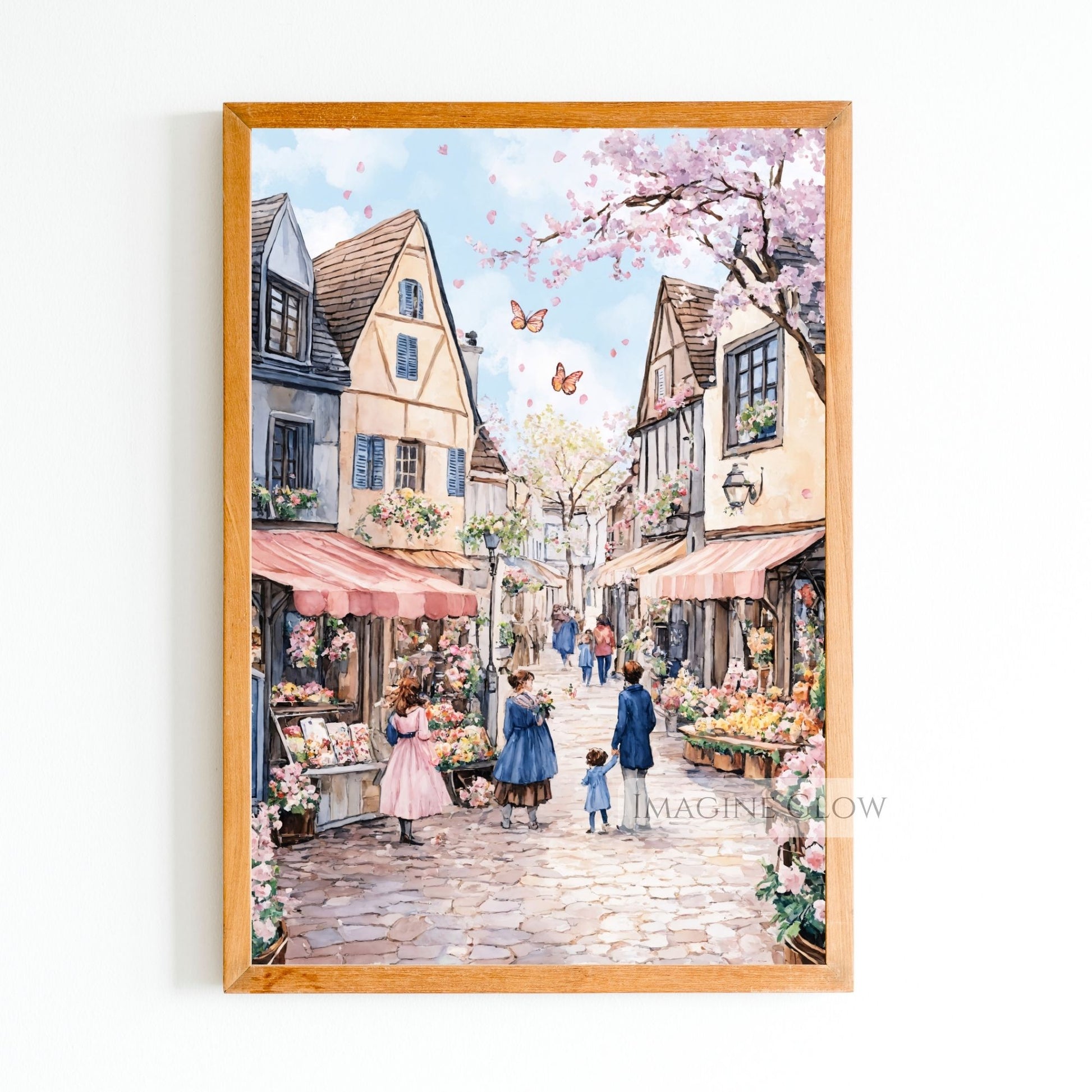 Charming cobblestone street in spring with tulips, cherry blossoms, and market stalls.
