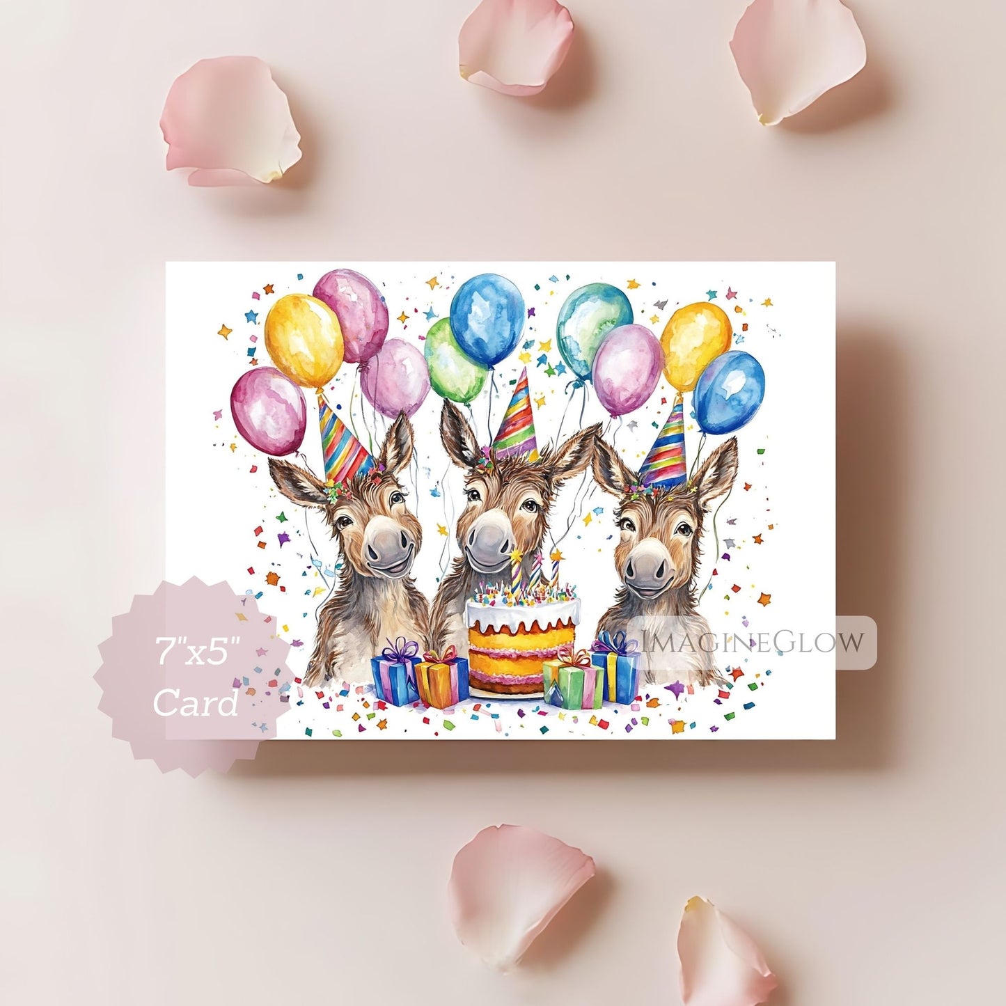 Birthday card with three donkeys, balloons, and a cake on a light pink background.