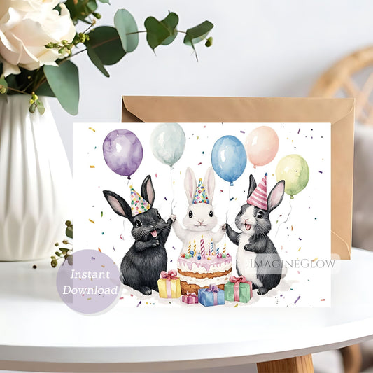 Greeting card with rabbits celebrating a birthday, balloons, and a cake on a white surface.