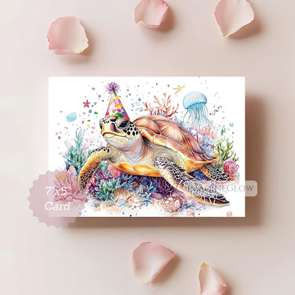 Colorful card with a turtle wearing a party hat surrounded by sea creatures on a light pink background.