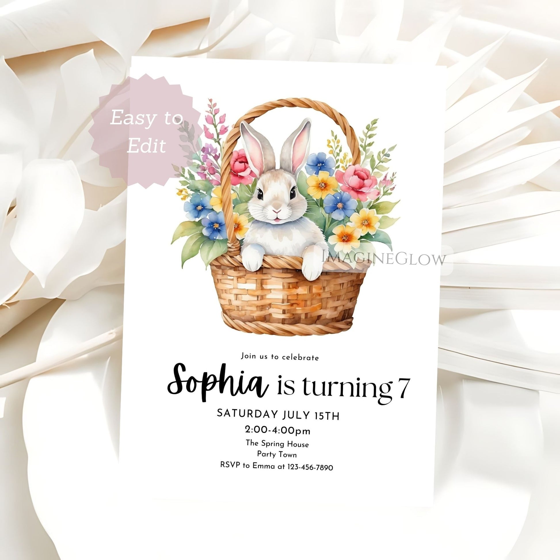 Invitation card with a rabbit and flowers in a basket on a white background