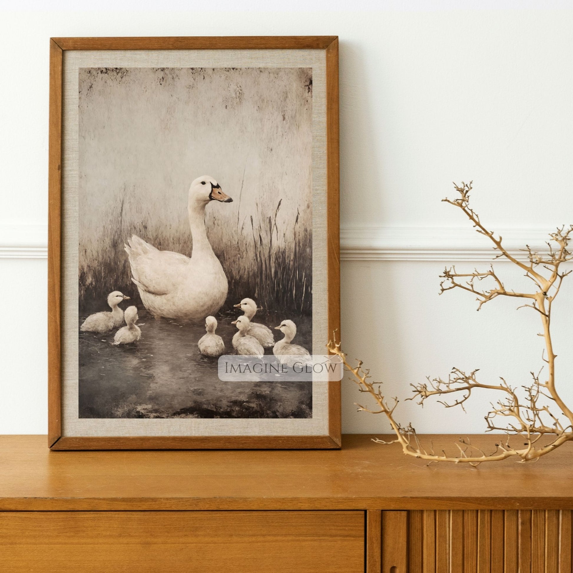 Serene painting of a white goose and goslings in a pond
