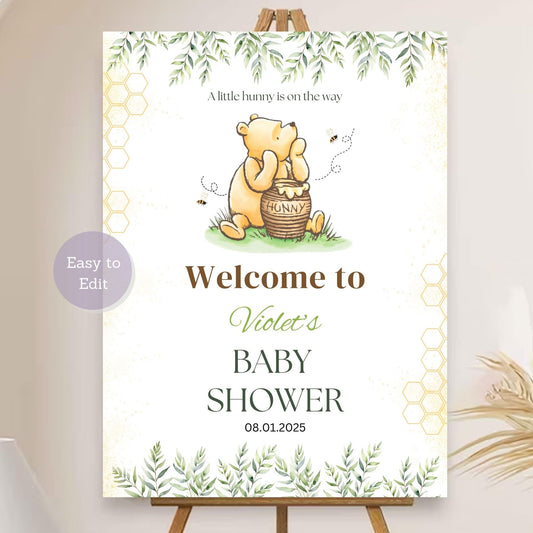 Winnie the Pooh baby shower welcome sign with "A Little Hunny on the Way."
