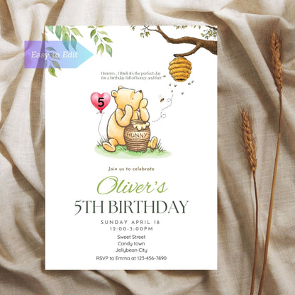 Winnie the Pooh birthday invite featuring an age balloon design.
